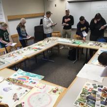 students working on analyzing the pictures drawn by Ridge students pictured