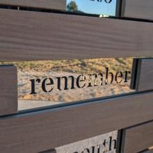 The word Remember edged in glass as part of the Commemorative
