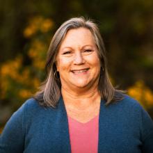 Portrait of Laurie Scherer outside 