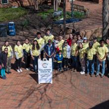 Volunteers pose on the campus patio for the kickoff of Bay to Bay service Days 