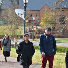 Sahar Shafqat  leads Estonian visitor Ain Hinsberg on a walking tour of campus 