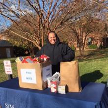 An SMCM staff member collects food donations