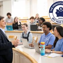 A professor speaks to students in a classroom; several students are seated with laptops. A "Princeton Review Best Value Colleges 2024" badge is displayed in the upper right corner.