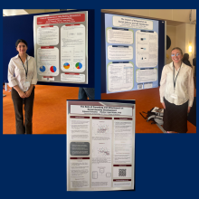 Three academic posters about social behavior research are displayed on boards; two individuals stand beside their respective posters, each wearing conference badges.