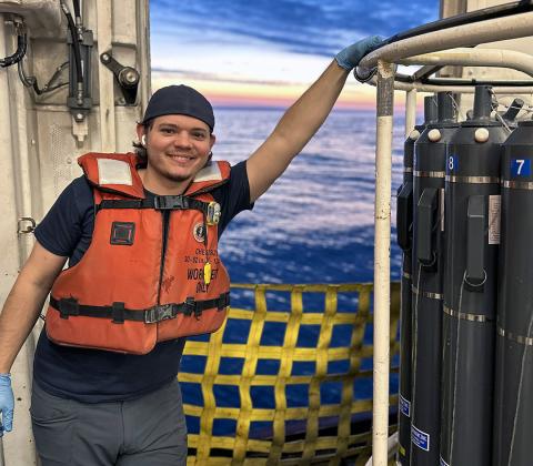 Robert Koontz standing near open hatch on R/V Sikuliaq