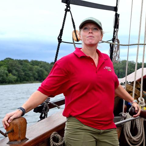 Woman at helm of historic sailing ship