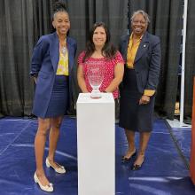 AD Gibson, Commissioner Dutton, President Jordan with the Presidents' Cup trophy