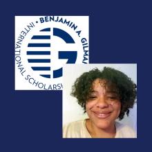 A person smiling in front of a white wall, overlaid on the Benjamin A. Gilman International Scholarship logo on a blue background.
