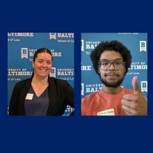 Two individuals pose in front of a blue University of Baltimore School of Law backdrop; one smiles, the other gives a thumbs up.