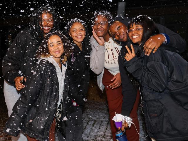 students posing in the snow