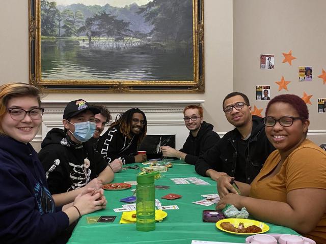 Students sitting at table playing games