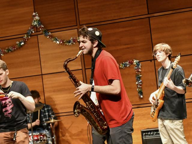 A member of SMCM Music Club plays saxophone during Spring showcase 