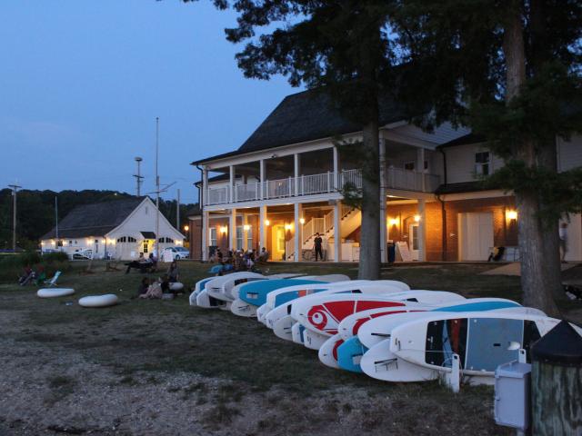River Center at night with paddleboards