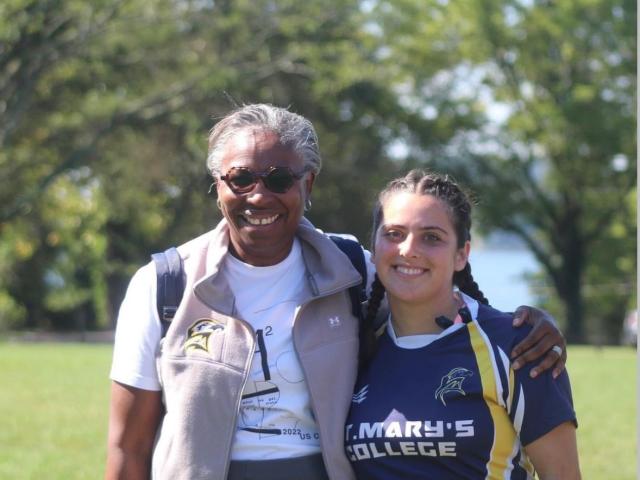 President Jordan and Camila Leiva pose after Women's Rugby last tournament. 