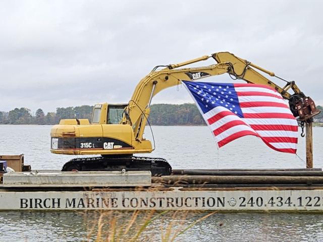 American flag flying off a barge