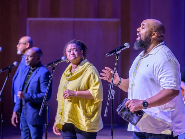 Four singers on stage