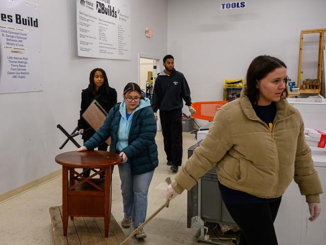 Students moving furniture