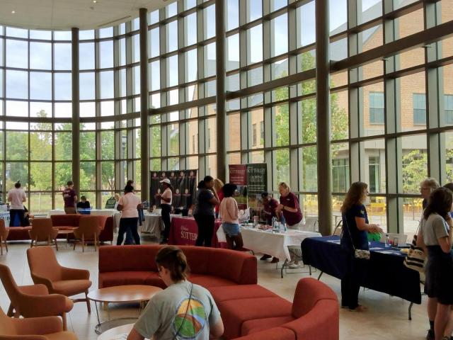 Students visit organization tables during the Volunteerism Day event