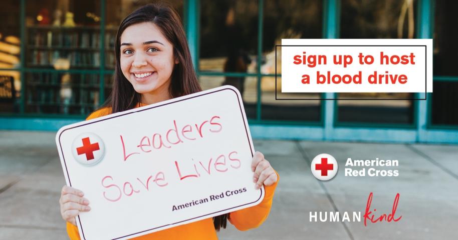 A person smiling and holding a sign that reads, "Leaders Save Lives - American Red Cross." Next to them, a text box says, "Sign up to host a blood drive." The American Red Cross logo is visible. The setting appears to be outdoors.