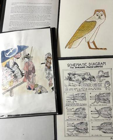 Assorted illustrations and a diagram on a table, including a stylized owl, colorful historical scene, and instructions for attaching a pigeon whistle.