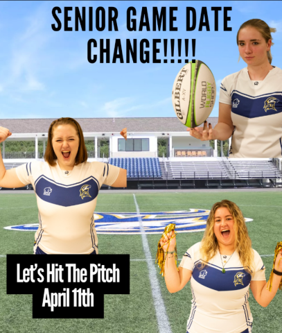 Three female rugby players in white uniforms pose on a field with text announcing a senior game date change to April 11th. The background shows empty bleachers at Jamie L. Roberts Stadium and a clear sky.