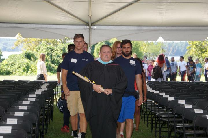 VP of Enrollment David Hautanen leads the procession of students