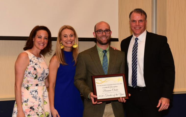 Pictured with (l-r) Cape school board President Alison Myers, Assistant Superintendent Jenny Nauman, Clarke and Cape Superintendent Bob Fulton, from Cape Gazette Newspaper.