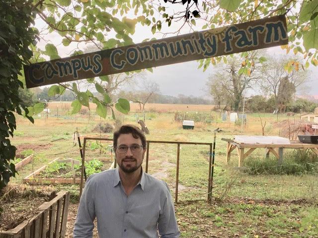 Professor Muchnick at the Kate Chandler Campus Community Farm