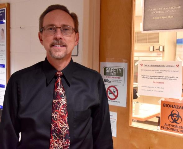 Professor Jeffrey Byrd outside of a teaching laboratory