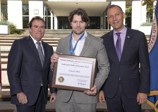Ethan Elliott '06 receiving NASA medal