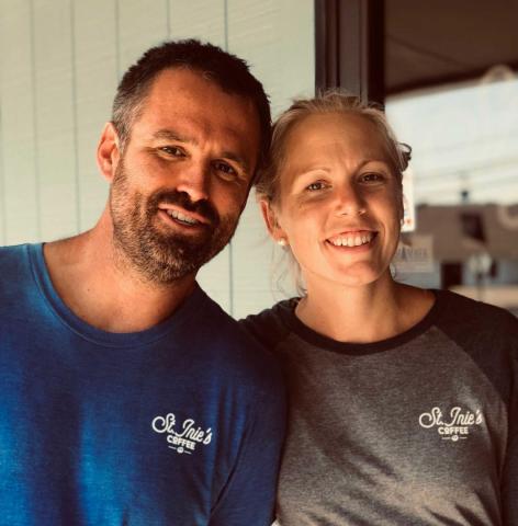 Catherine Grube '06 poses with husband Howie Grube '04 outside their Lexington Park business