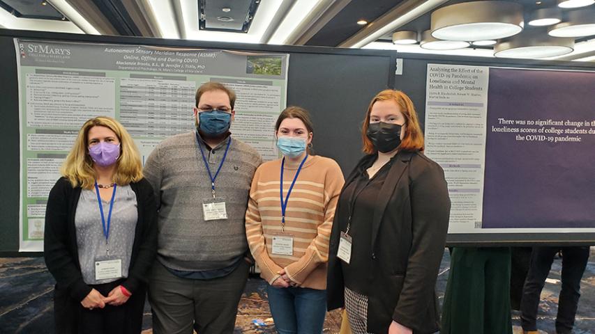 Associate Professor Tickle with psychology student and alumni at conference