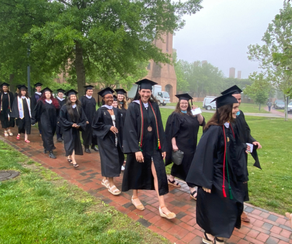 The Class of 2022 walking along the path toward commencement