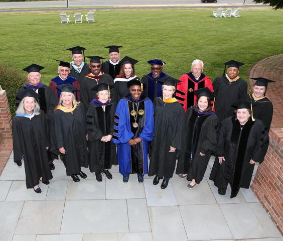 SMCM President Tuajuanda Jordan (center, blue regalia) with members of the SMCM Board of Trustees, May 2023