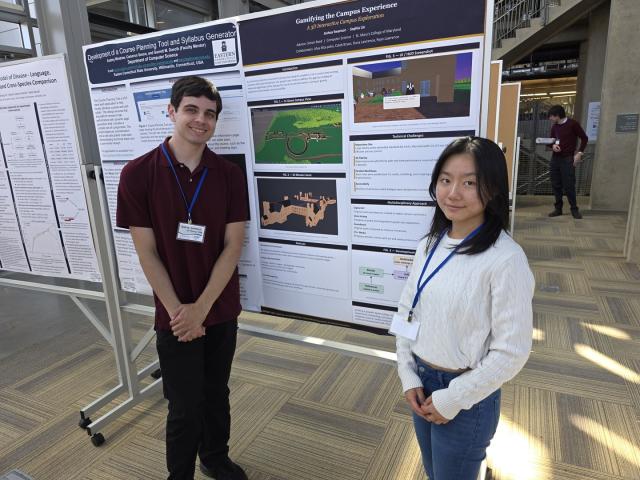 Sophia Lin (COSC 2026) and Joshua D. Swanson (COSC 2026)  stand in front of their poster at the conference.