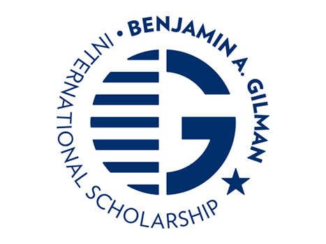 Logo of the Benjamin A. Gilman International Scholarship, featuring a stylized "G" with horizontal stripes and a star, surrounded by the program name in blue text.