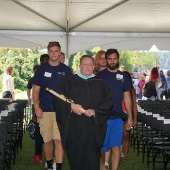 VP of Enrollment David Hautanen leads the procession of students 