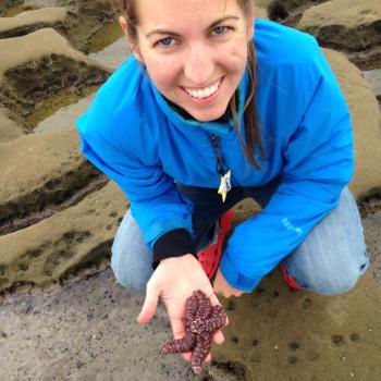 Cassie Gurbisz holding a star fish 