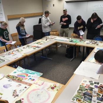 students working on analyzing the pictures drawn by Ridge students pictured