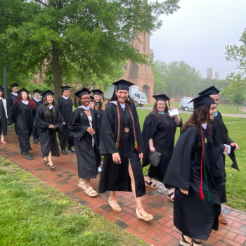 The Class of 2022 walking along the path toward commencement 