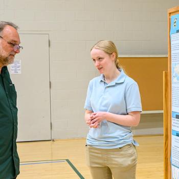 student presenting research
