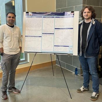 James Ripple (right) and Anish Agashe (left) at the APS-MAS 2023 meeting.